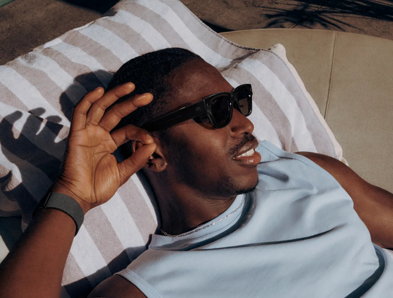 A man controls Ray-Ban Meta Display glasses with gesture
