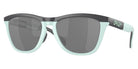 Oakley® 0OO9284 - Frogskins range 0OO9284 928403 55 - Matte Carbon/Blue Milkshake/Prizm black Sunglasses